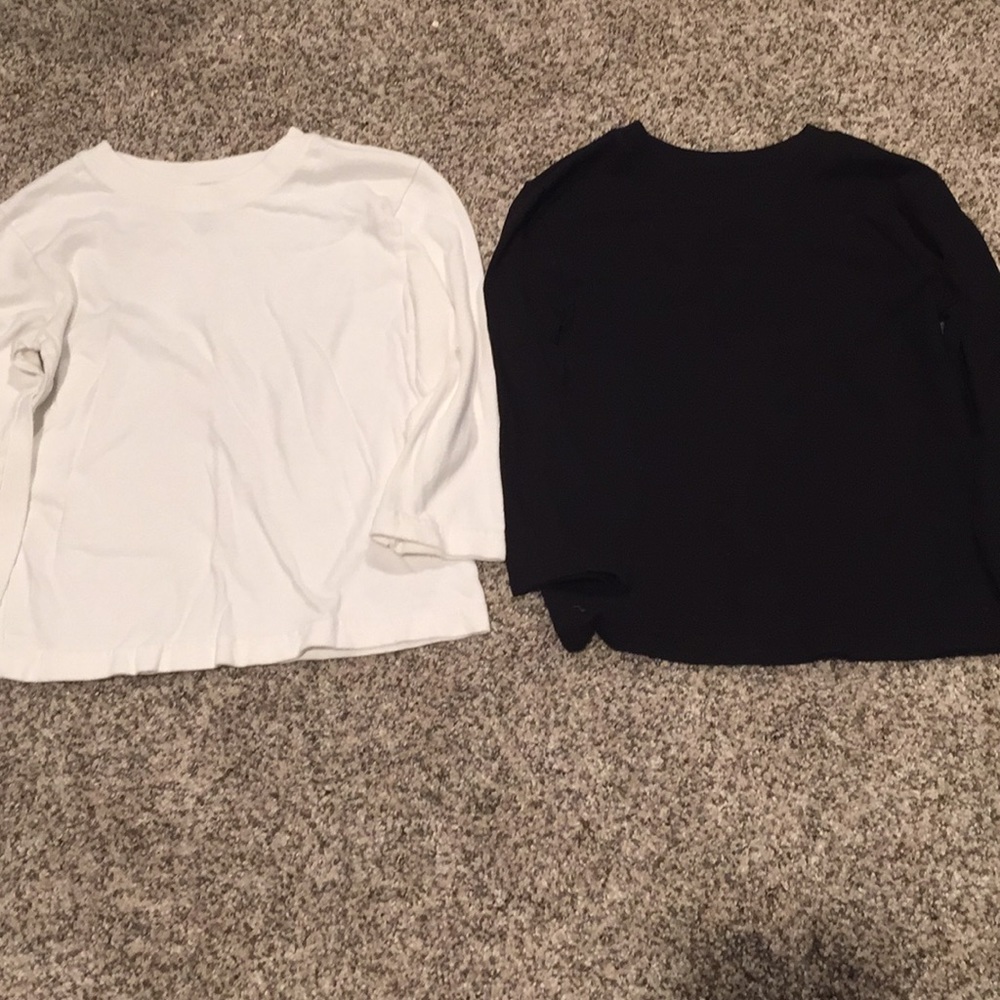 Set of two shirts, solid black and solid white.
